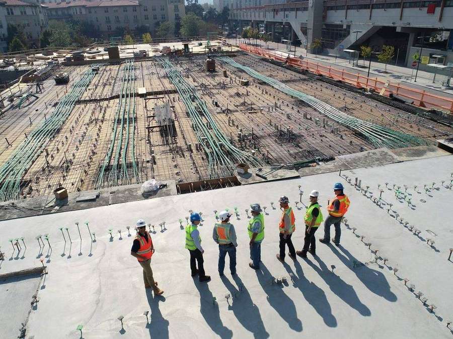 Engineers and workers on an active Contech construction site